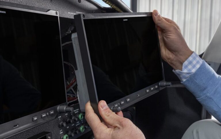 Garmin AXIS display being fitted into an aircraft instrument panel